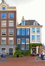 Amsterdam, Holland 30.08.2019. Cityscape with narrow street and facade of old buildings in historical centre of Duch capital,