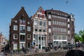 Amsterdam in Holland with its magnificent brunch breakfast canals, its levi barge bridge and traditional boat, flowery city bike