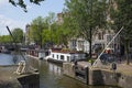 Boat lock on the Korte Prinsengracht and houseboat with flowers