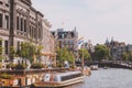 Amsterdam, Holland, May 11th 2018: Typical canal in the city of Amsterdam with the boats used as transport