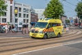 Amsterdam, Holland, Netherlands, August 2018, ambulance speeding through the centre of Amsterdam near the Stopera over the bridge