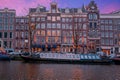 Amsterdam houses along the canal at sunset in the Netherlands Royalty Free Stock Photo