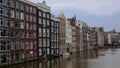 The beautiful city of Amsterdam, ancient architecture, river canals and boats. Holland