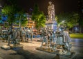 Night view of the statues based on the famous Rembrandt painting The Nightwatch on the Rembrandtplein in the center of Amsterdam