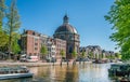 Amsterdam, May 7 2018 - tourist boat on the Singel Channel with