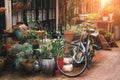 Amsterdam narrow street with building exterior decorated by green plants and flowers with old vintage bike Royalty Free Stock Photo