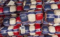 Amsterdam, Nederland. Shop window of a food store with traditional Dutch cheeses. Red, white, and blue plastic packaging