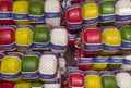 Amsterdam, Nederland. Shop window of a food store with traditional Dutch cheeses. Red, white, yellow and green plastic packaging