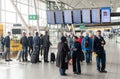 AMSTERDAM, NETHERLAND - OCTOBER 18, 2017: International Amsterdam Airport Schiphol Interior with Passengers. Group of people looki