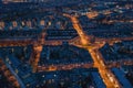 Amsterdam, Netherlands. Aerial view from drone of old historical center with famous dancing houses and illuminated Royalty Free Stock Photo