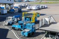 Airport ground handling support equipment, vehicles, tugs, stairs, dollies for cargo pallets at Amsterdam Airport Schiphol AMS