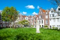 Amsterdam, Netherlands-April 30: The Begijnhof courtyard during the sunny day on April 30,2015, the Netherlands.