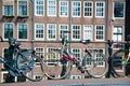 Bicycle on the city street river channel bridge in Amsterdam