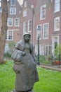 Close-up on the statue of a Beguine, located in the internal courtyard of Begijnhof, one of the oldest hofjes in Amsterdam