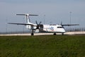 Flybe Bombardier DHC-8 Q400 G-KKEV passenger plane taxiing at Amsterdam Schipol Airport Royalty Free Stock Photo