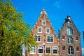House architecture in Amsterdam. Traditional old dutch buildings.