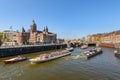 Sightseeng at Canal Boats near the Central Station of Amsterdam