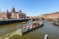 Sightseeng at Canal Boats near the Central Station of Amsterdam