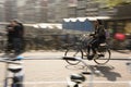 A Women Rides her bike in Amsterdam traffic, Netherlands. Royalty Free Stock Photo