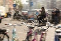 A Women Rides her bike in Amsterdam traffic, Netherlands. Royalty Free Stock Photo