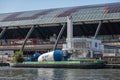 Barge with cement mill docked on IJ river, Amsterdam, Netherlands