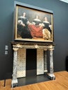 Amsterdam, Netherlands. August 11, 2023. One of the rooms of the Rijksmuseum with antique fireplace and oil painting.