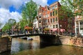 Amsterdam, Netherlands - August 3, 2017: Traditional dutch bicycles parked on Hilletjesbrug bridge over Egelantiersgracht canal. Royalty Free Stock Photo