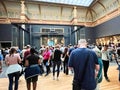 Amsterdam, Netherlands. August 6, 2023. Visitors admire one of the many paintings at the Rijksmuseum in Amsterdam.