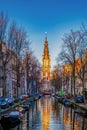 Amsterdam Netherlands Beautiful Groenburgwal canal in Amsterdam with the Soutern church Zuiderkerk at sunset