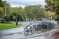 Amsterdam, Netherlands, 10/12/2019: Bicycle parking in a city with beautiful architecture on a rainy day