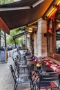 Amsterdam, Netherlands, 10/10/2019: Cafe tables on a city street. Royalty Free Stock Photo