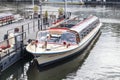 Canal tour boat moored at pier and waiting for passengers