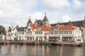 Canal tour boats moored and waiting for passengers. Urban landscape and historic building