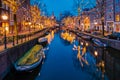 Amsterdam Netherlands canals with christmas lights during December, canal historical centre of Amsterdam at night