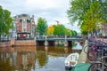 Amsterdam, Netherlands - 14.10.2019: Colorful houses and Boats on Amsterdam Canal. Autumn in Amsterdam Royalty Free Stock Photo