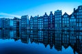 Amsterdam Netherlands dancing houses over river Amstel landmark in old european city Royalty Free Stock Photo