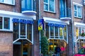 Amsterdam, Netherlands - December 14, 2017: The blue neon coffee shop sign.