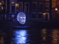 AMSTERDAM, NETHERLANDS - DECEMBER 19, 2015: Light installations on night canals of Amsterdam within light festival on December 19, Royalty Free Stock Photo