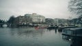 AMSTERDAM, NETHERLANDS - DECEMBER 26, 2017. River tour boat passing canal locks Royalty Free Stock Photo