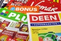 Stack of Dutch grocery shop sale flyers