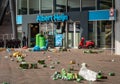 Front view of Albert Heijn Dutch supermarket chain at Johan Cruijff Boulevard, with trash in the street left by football fans Royalty Free Stock Photo