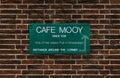 Green plate on a red bricked wall informing that the pub called Cafe Mooy was established in 1726 Royalty Free Stock Photo