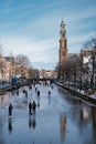 Ice skating on the canals in Amsterdam the Netherlands in winter, frozen canals in Amsterdam during winter Royalty Free Stock Photo