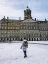 Amsterdam Netherlands, frozen canals and people ice skating in Amsterdam