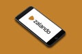 Amsterdam, The Netherlands, 08/18/2019, iPhone 8 plus smart phone lies on a flat colored surface. Zalando corporated logo o