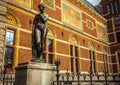 AMSTERDAM, NETHERLANDS - JANUARY 1, 2016: Ancient bronze statue in park of The Rijksmuseum. Netherlands national museum. Amsterda