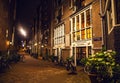 AMSTERDAM, NETHERLANDS - JANUARY 22 2016: City streets of Amsterdam at night. General views of city landscape on January 22, 2016