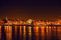 AMSTERDAM, NETHERLANDS - JANUARY 1, 2016: General view on night canal in center of Amsterdam from bridge near museum Nemo. On Jan Royalty Free Stock Photo