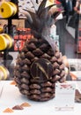 AMSTERDAM, NETHERLANDS - JULY 18, 2018: Chocolate pineapple in store at Schiphol Plaza, shop exterior