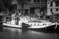 AMSTERDAM, NETHERLANDS. JUNE 06, 2021. Beautiful view of Amsterdam with typical dutch houses, bridges and chanel. Black and white